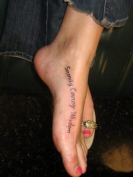 Many of my favorite foot tattoos feature words, sayings, and phrases tattooed on the side of the foot.