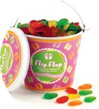 Flip flops gummi candies in a beach pail.