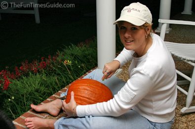Lynnette carving pumpkins and showing off her feet!